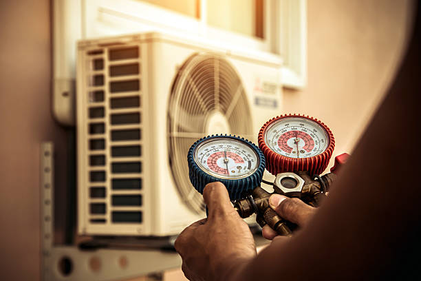Professional Hvac technician working in Vallonia, IN